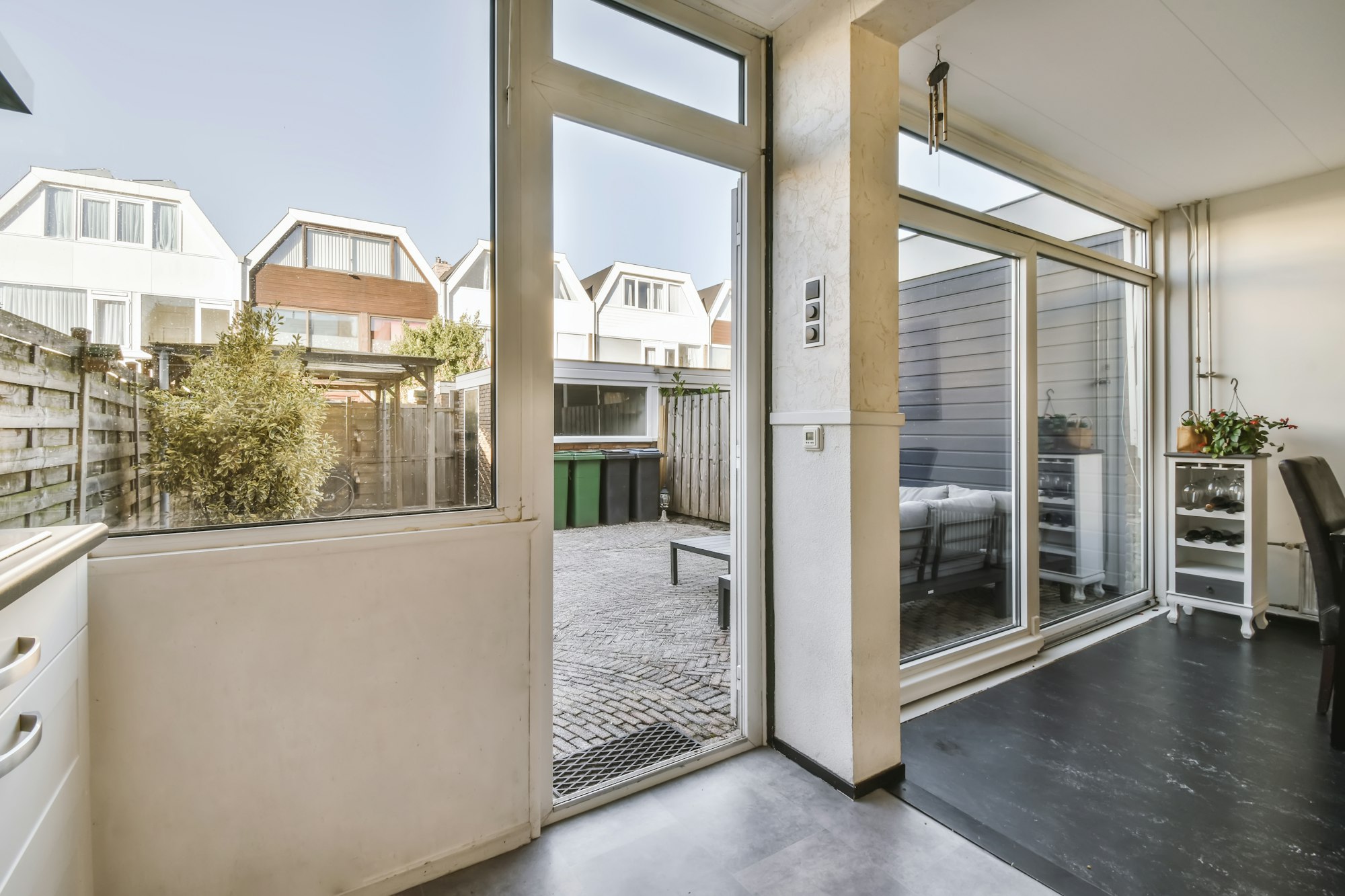 A huge window in a stylish room with a door